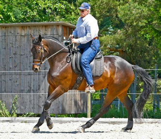 Instructor Berni Zambail riding a horse